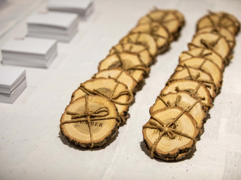 Slices of wood branded with Humber logo wrapped in twine