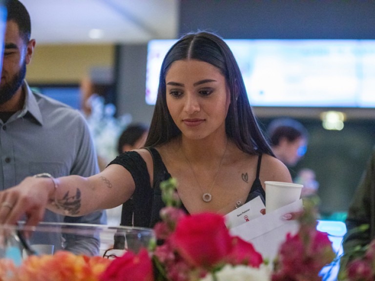 Person reaching for something on refreshment table