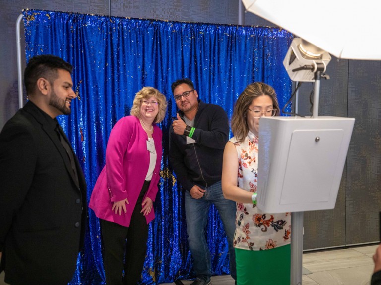 President Ann Marie Vaughan standing with someone making thumbs up