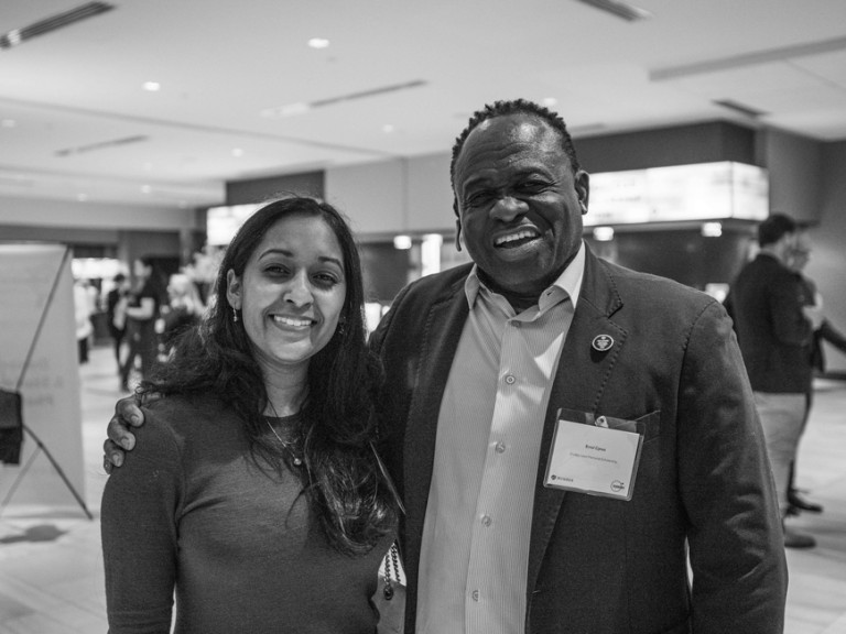 Black and white photo of two people posing for camera