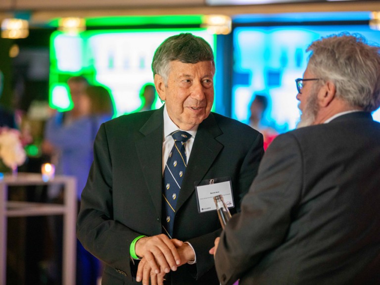 Two men in suits talking