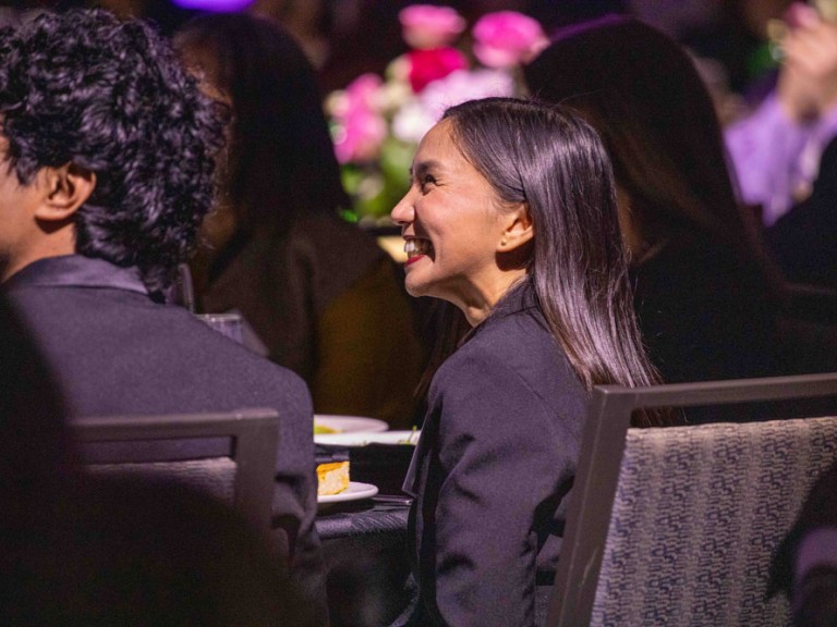 Person in audience smiling