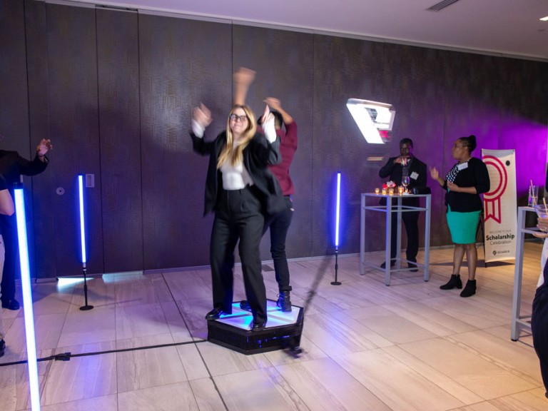 Two people dancing on light up dance pad