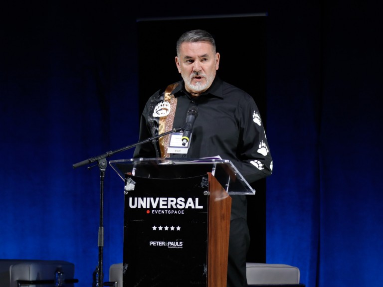 Person speaking on stage
