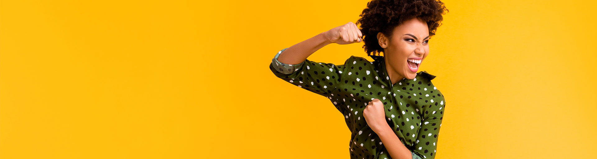 woman in the air doing a sideways kick on a bright yellow background
