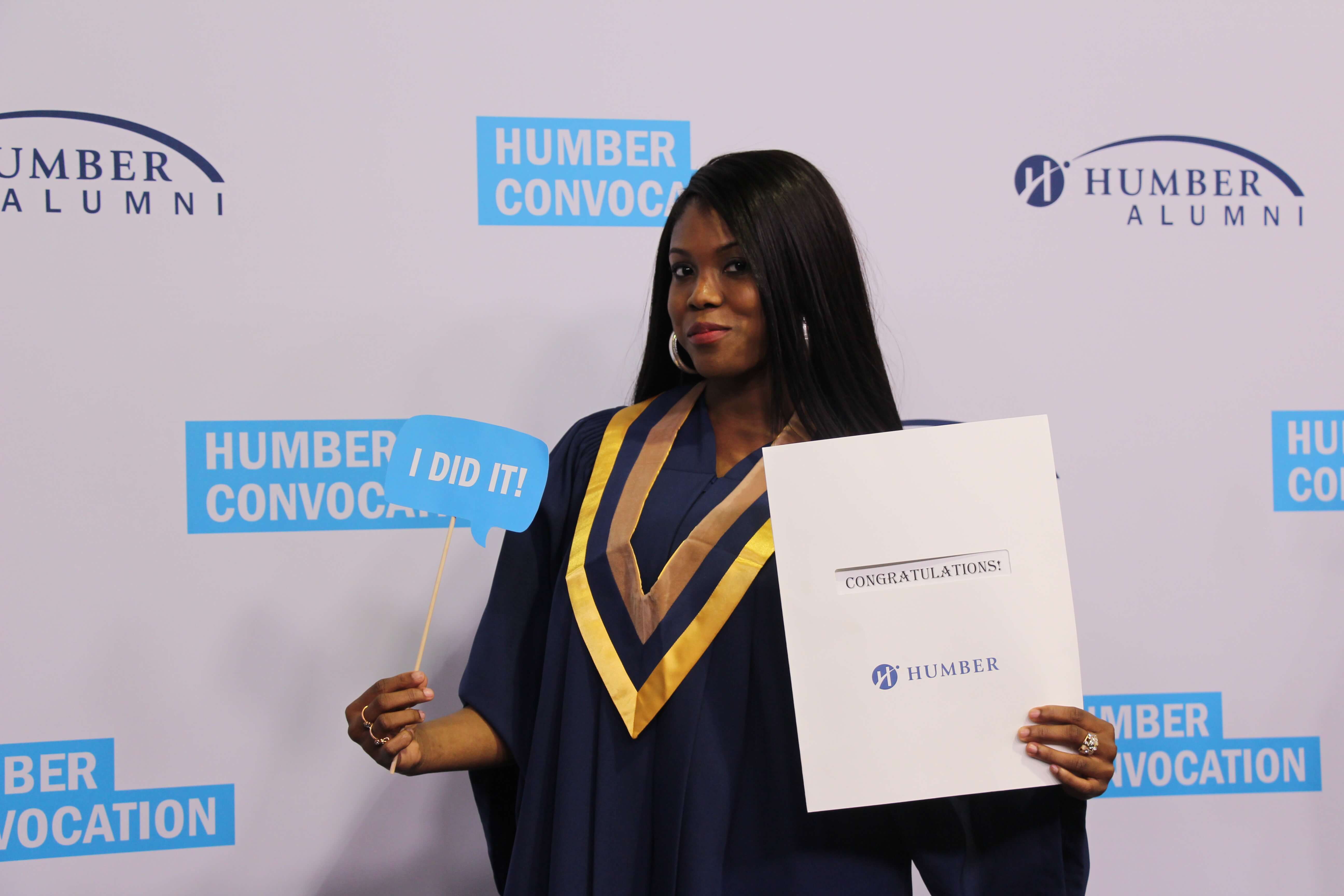 Student posing for after graduation pic