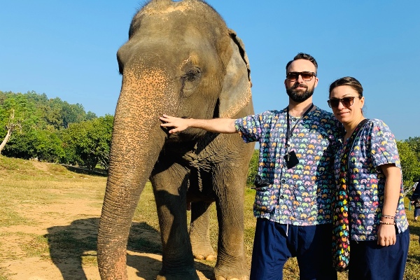 Athena and Jordan posing with an elephant