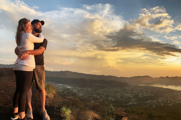 Athena and Jordan overlooking the view on a cliff