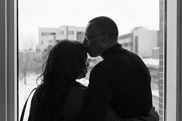 marcia and leroy kiss on forehead