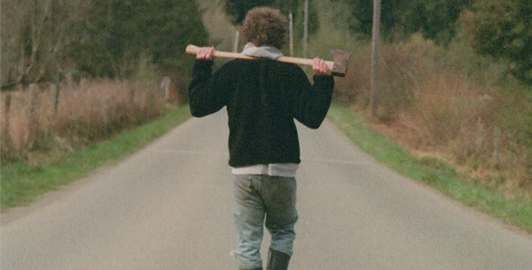man walking with an ax