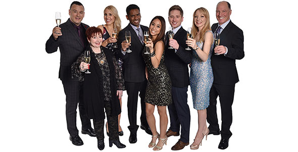 group of people holding glasses