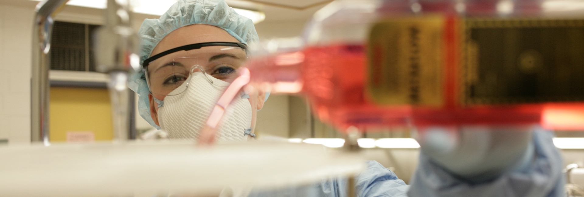 lab technician pouring