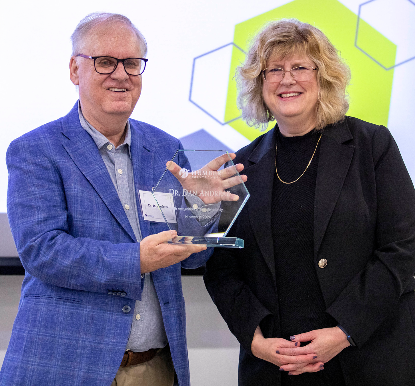 Dr. Andreae holding Plaque