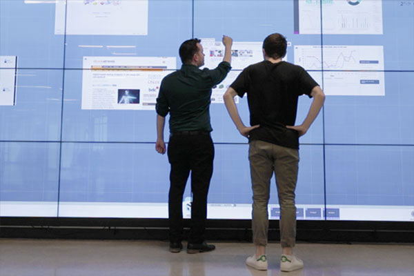 People using interactive screen display