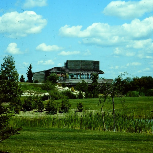 A clearly aged photo shows an old wooden nature centre in a much sparser Humber Arboretum