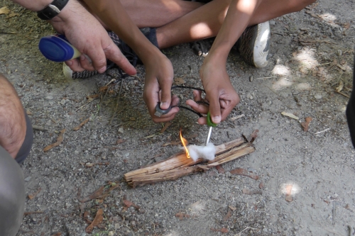 A Junior Naturalist has successfully sparked a small fire using a rod and flint