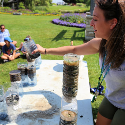 A counsellor demonstrates a soil activity