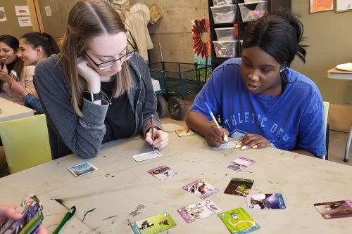 Students concentrate as they work out their scores for Birds of a Feather