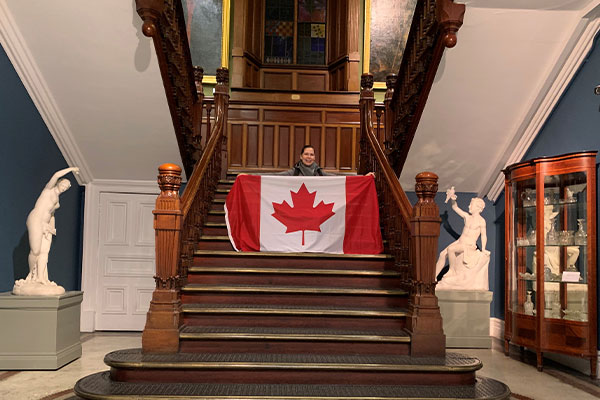 Isabelita Shotunde Holding the Canadian flag