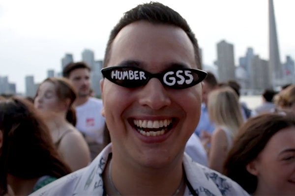 Student wearing glasses that say Humber GSS