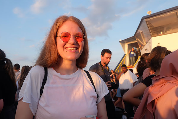 Female student smiling on the party boat
