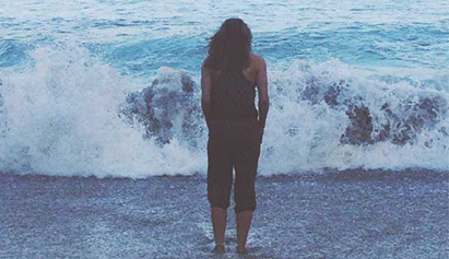 lady standing in ocean