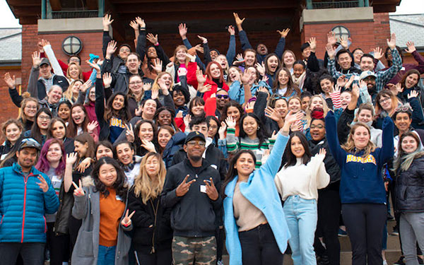 group of international students cheering in a group