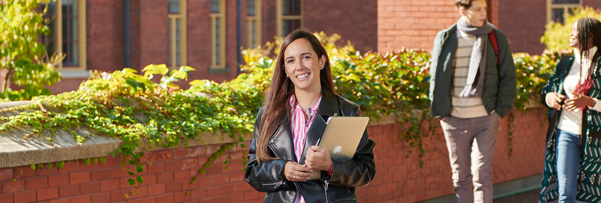 Person Smiling while Holding books