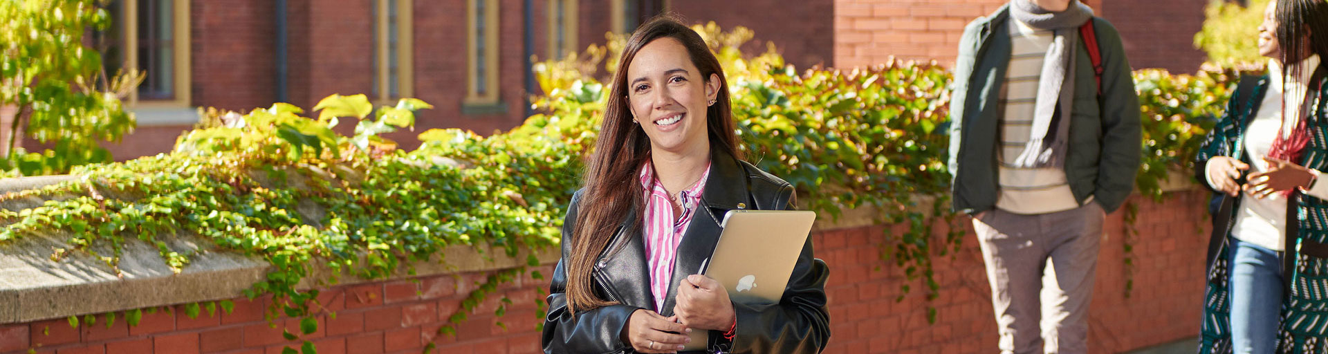 Person Smiling while Holding books