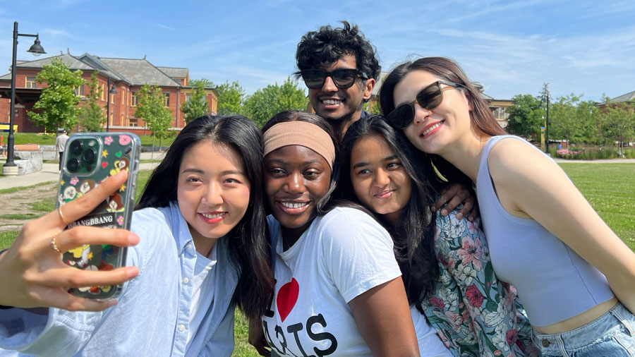 Five students taking a selfie together