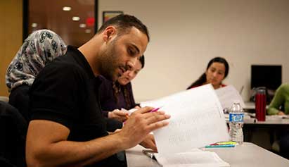 man looking at paper