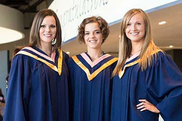 A group of graduates in their regalia at a Humber College graduation ceremony. 