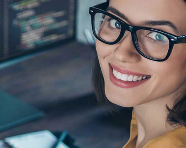 smiling woman writing code