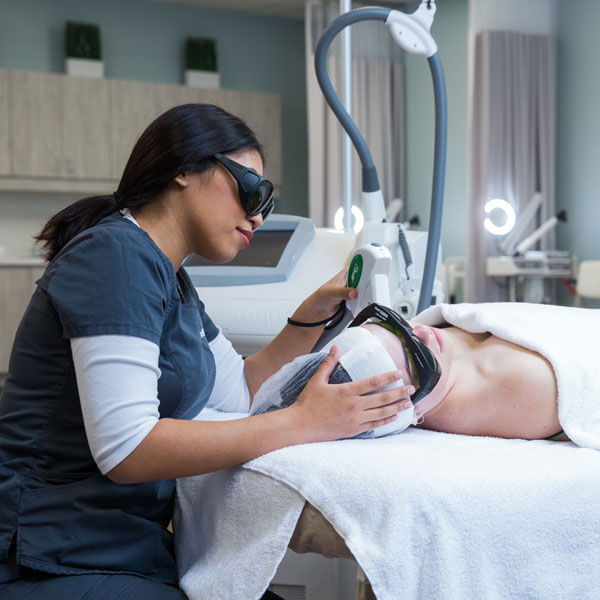 student working in the Humber Spa with facial tool