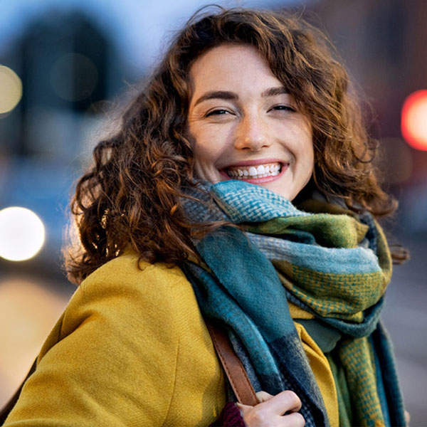 person standing and smiling