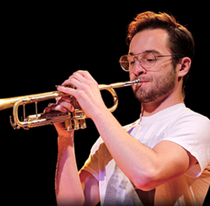 student playing the trumpet