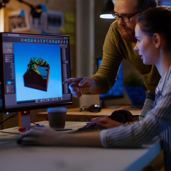 teacher looking at student's 3d rendered art