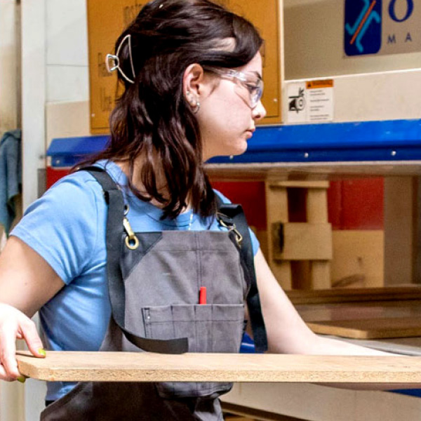 student in the wood working lab