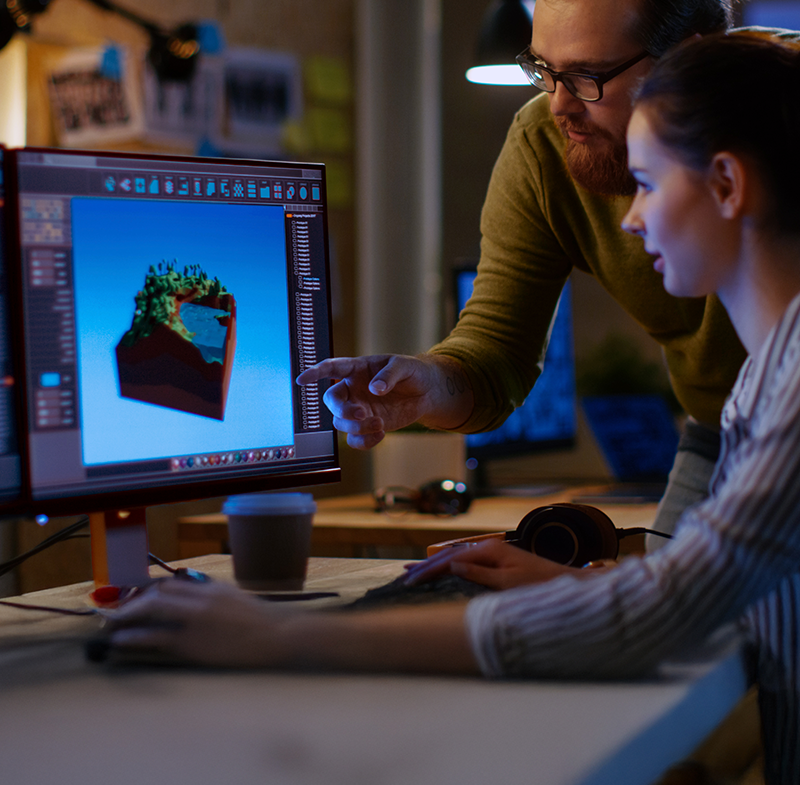 two people working at a computer