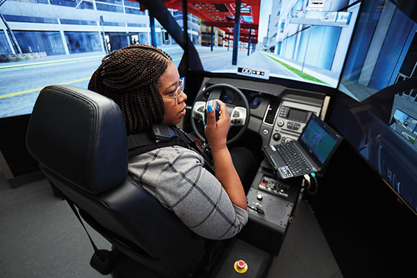 student in the driving simulation lab