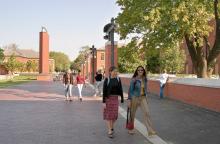 Students walking a tree lined path