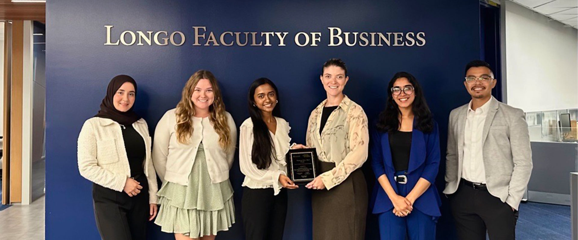 The team posing for a picture