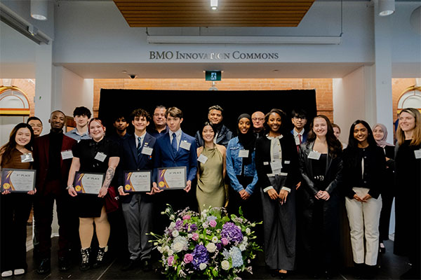 Students on stage receiving awards