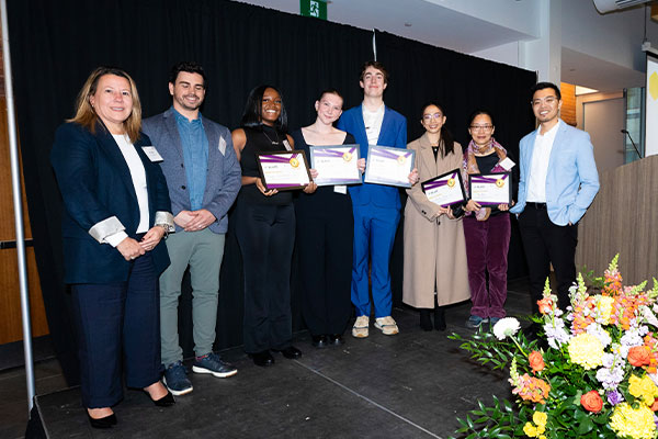 Students on stage receiving awards