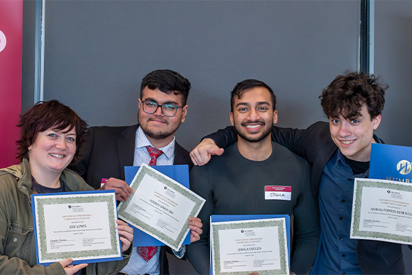 People holding certificates