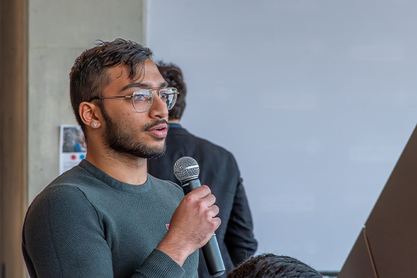 Audience member speaking on microphone