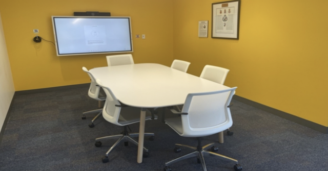 Small Meeting Room with table, chairs and screen
