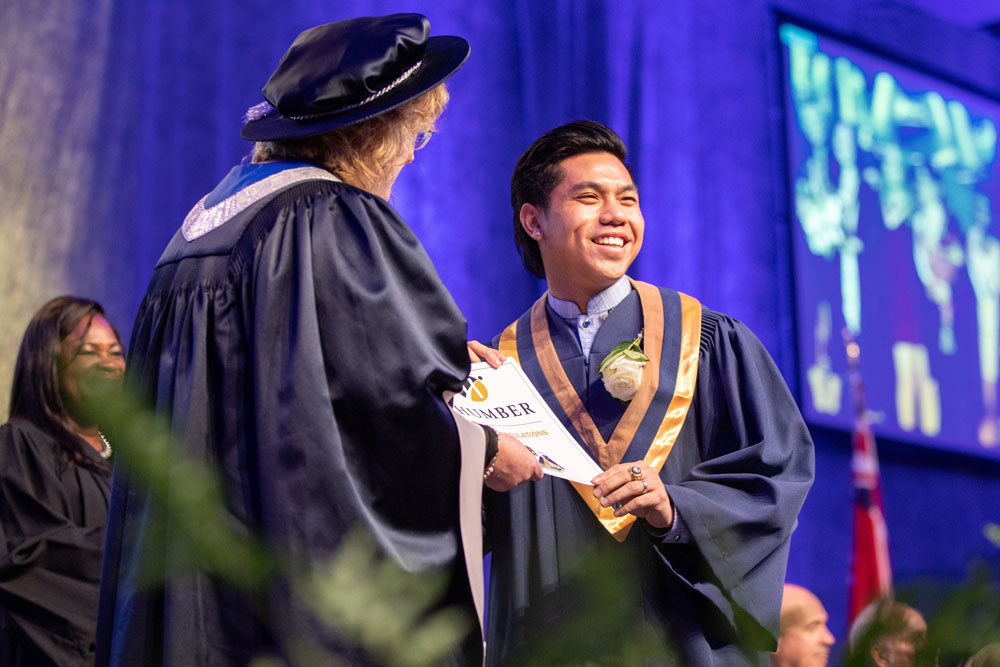 Happy graduate receiving certificate