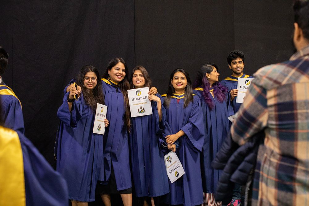 Group of grads getting photo taken