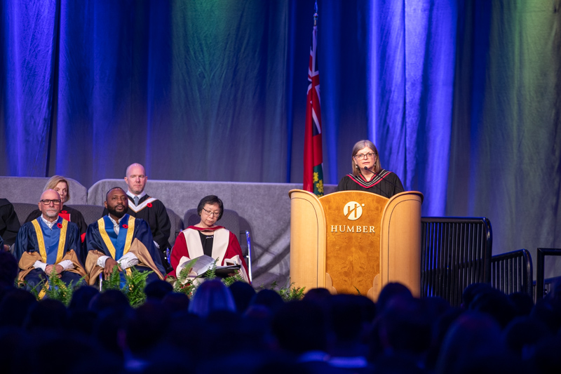 Person behind Humber podium on stage